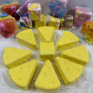 Realistic yellow cheese slice slow rebound squishy stress relief toy set on white faux fur