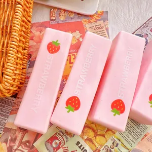 Close-up detail view of pink strawberry milk stick squishy toys for stress relief