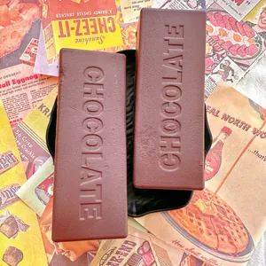 Realistic chocolate bar squishy toy with embossed texture on creative vintage advertising backdrop