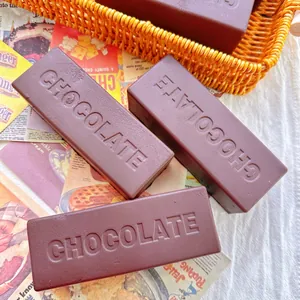 Close-up of chocolate bar shaped squishy toys with realistic embossed texture.
