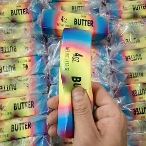 Soft slow rising butter stick squishy toy with colorful rainbow gradient design.