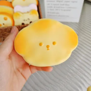 Close-up of a soft yellow butter slow-rebound squishy toy with a cute face for stress relief toys.
