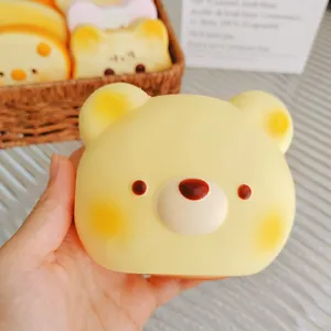 Close-up of a cute soft yellow bear-shaped slow rebound squishy toy for stress relief