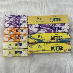 Detail view of colorful marble pattern butter stick squishy toys in two sizes