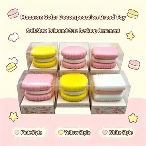 Detailed macro view of macaron-colored sandwich biscuit squishies in clear retail boxes