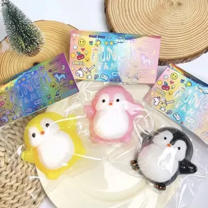 Detail view of three colorful squishy penguin toys in clear individual packaging