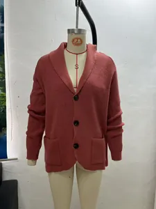 Front view of rust knitted shawl collar cardigan with buttons on mannequin
