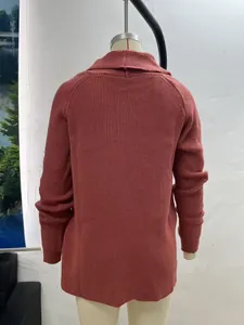 Back view of a brick red knit cardigan with shawl collar on a white mannequin