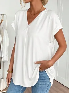 Close-up of white V-neck short sleeve top for women featuring soft fabric and rolled cuffs