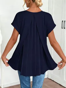 Detailed view of the elegant pleated back design on a navy blue short sleeve top