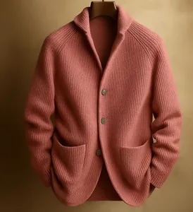Detailed view of the ribbed texture and buttons on a pink shawl collar knitted cardigan