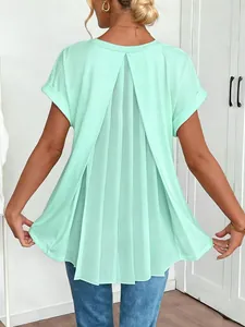 Detailed view of mint green short sleeve top with elegant pleated back design