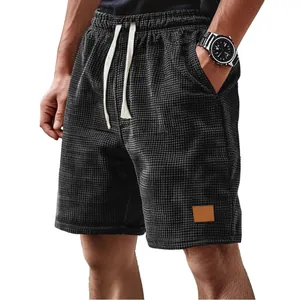 Stylish men's casual waffle knit drawstring shorts in charcoal grey with elastic waist