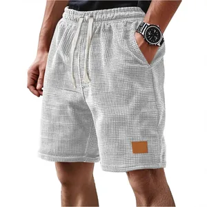 Men's casual waffle knit shorts featuring elastic drawstring waist in light grey color