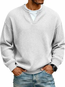 Detailed macro view of men's grey waffle-knit shirt with fake two-piece collar design