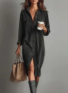 Elegant charcoal grey corduroy shirt dress with flap pockets for a sophisticated look.