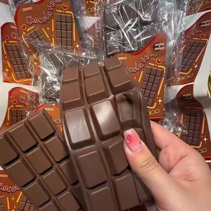 Detail view showing the soft texture of a realistic giant chocolate bar PU squishy toy