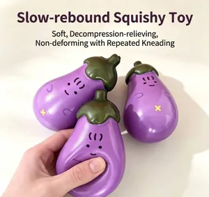 Close-up of a hand squeezing a soft purple eggplant-shaped slow rebound squishy toy