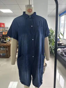 Dark blue short sleeve denim jumpsuit with button-down collar and multiple pockets.