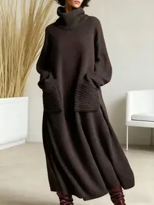 Cozy brown turtleneck maxi knit dress with oversized front pockets, soft texture.