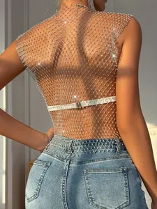 Close-up of a shimmering rhinestone mesh top featuring delicate silver sparkle details.