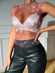 Detailed view of pink fishnet top featuring sparkling rhinestones and mesh texture