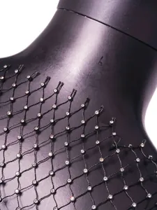 Close-up of black fishnet top with sparkling rhinestones and crew neck detail