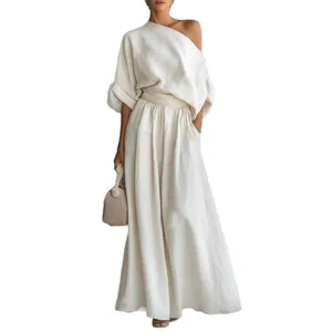 Elegante set top monospalla e pantaloni a gamba larga in tessuto di lino beige chiaro