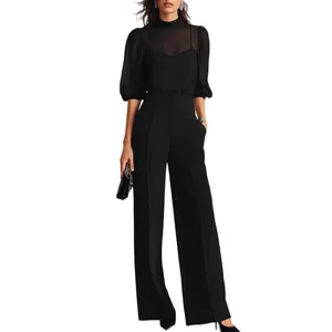 Fashionable black sheer puff sleeve top and high-waisted wide-leg trousers two-piece set