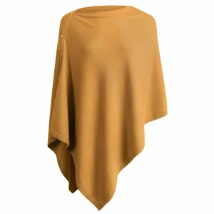 Elegant mustard yellow knit poncho wrap with decorative buttons for autumn and winter