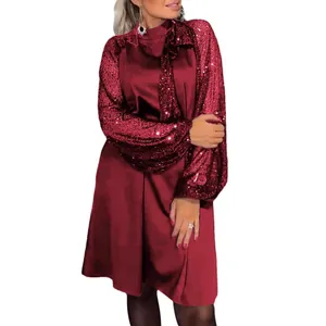 Elegante abito corto bordeaux con paillettes e maniche lunghe con un fiocco chic