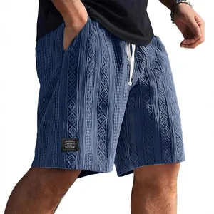 Men's stylish blue casual shorts with unique jacquard texture and drawstring waist.
