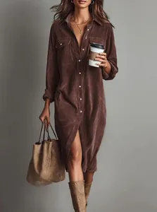 Elegant brown corduroy shirt dress featuring button-front and chest pockets detail