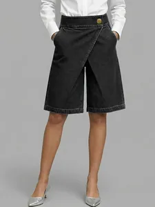 Chic women's black faux denim culottes with a unique asymmetric wrap front design