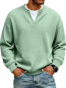 Macro detail view of men's sage green waffle knit long sleeve shirt with a v-neck