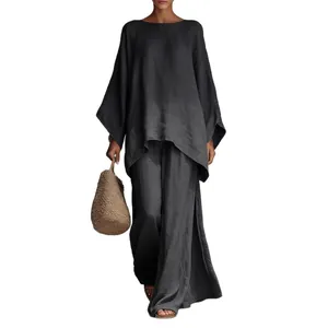 Elegante conjunto de dos piezas de lino gris oscuro para mujer con camisa y pantalón ancho.