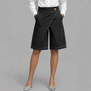 Women's high-waist asymmetrical black faux denim culottes with gold button detail