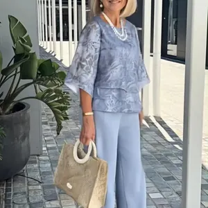 Elegant chiffon floral printed two-piece set with round neck top and wide leg pants.