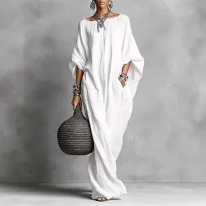 Elegant white bohemian cotton maxi dress with an oversized silhouette and texture