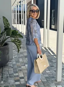 Elegant blue chiffon printed two-piece set featuring a layered top and wide-leg pants