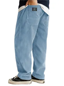 Detailed view of men's blue corduroy pants showing fabric texture and back pocket label