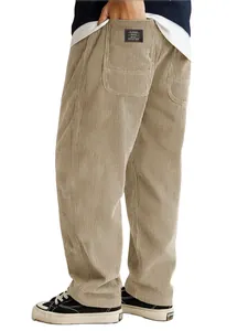 Detail view of the back pocket on men's khaki corduroy pants with a classic label.