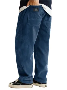 Close-up of men's loose blue corduroy pants featuring back pocket with letter label