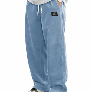 Pantalon décontracté large en velours côtelé pour homme avec cordon et patch logo chic