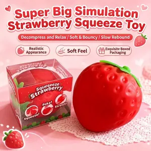 Large realistic strawberry squishy stress relief toy with retail box packaging.