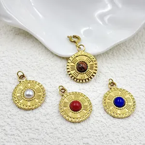 Close-up of gold plated stainless steel round pendants with colorful natural stones