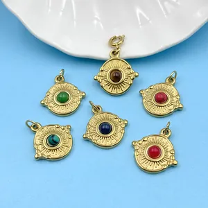 Detailed view of six stainless steel round pendants with colorful natural stones.
