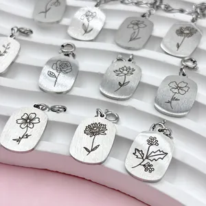 Detailed view of various stainless steel birth month flower engraved pendant charms
