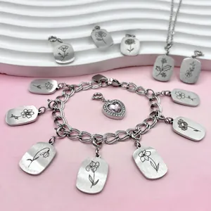 Detailed view of high-quality stainless steel birth flower pendants with laser-engraved designs