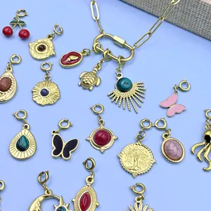 Assorted gold-plated stainless steel DIY charms featuring colorful stones and enamel designs